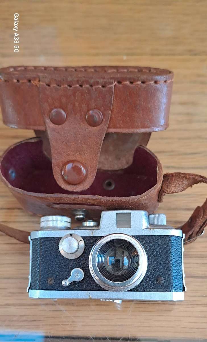 A Morita Kiku 16 Model II subminiature camera, within a leather case