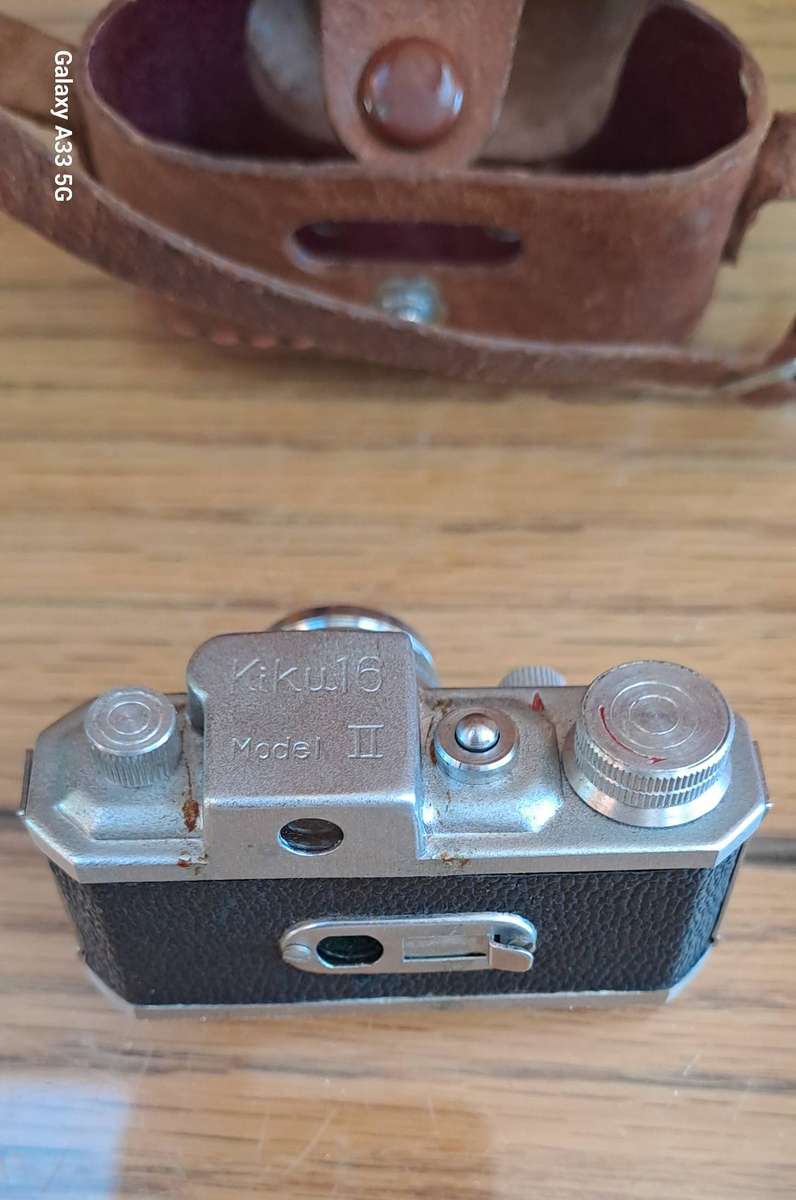 A Morita Kiku 16 Model II subminiature camera, within a leather case