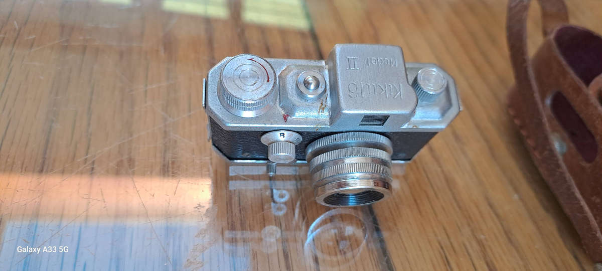 A Morita Kiku 16 Model II subminiature camera, within a leather case
