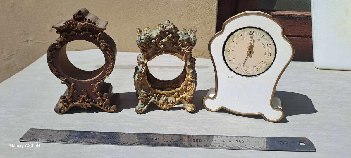 2 small clock housings 1 wood 1x brass and 1x small clock