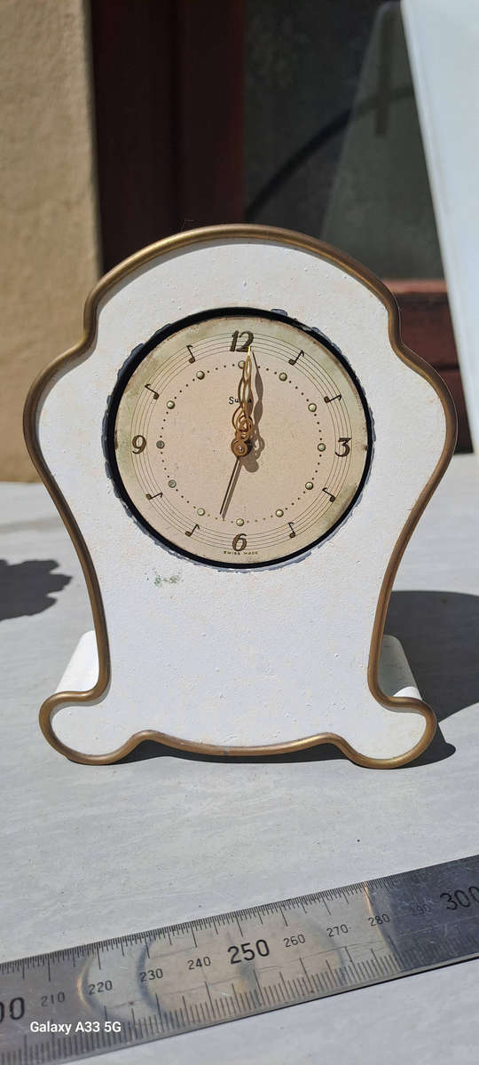 2 small clock housings 1 wood 1x brass and 1x small clock