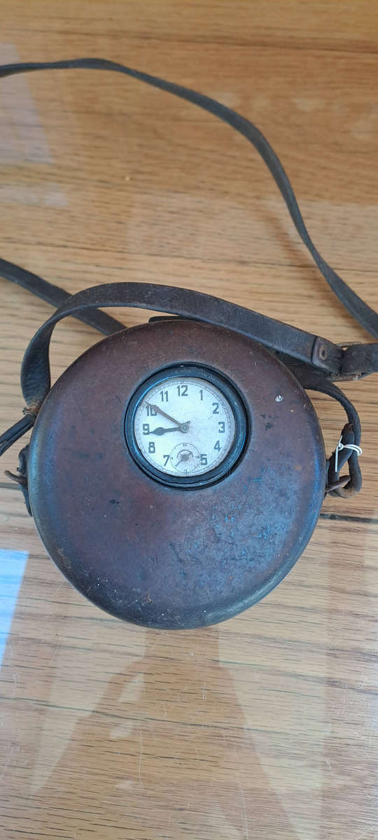 Night watchmans clock in leather case