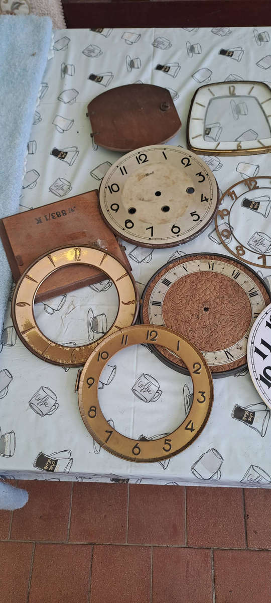 Lot of vintage clock faces, bezels, glass etc