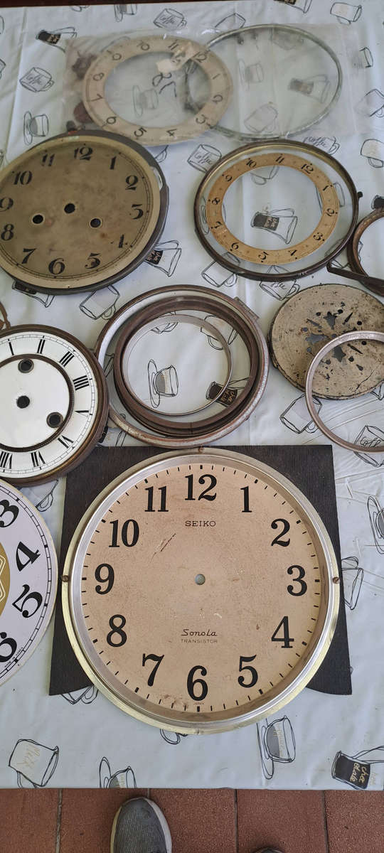 Lot of vintage clock faces, bezels, glass etc