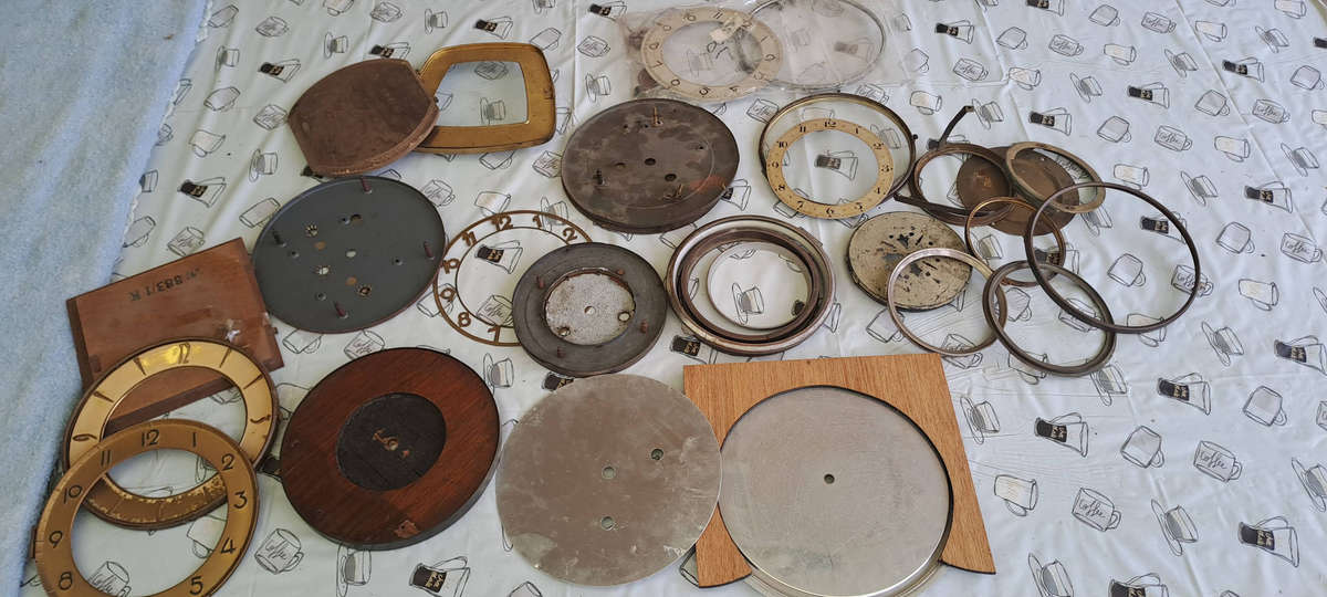 Lot of vintage clock faces, bezels, glass etc