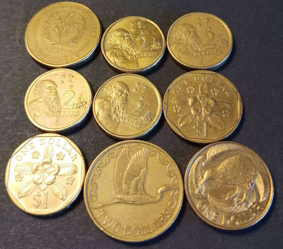 14 X Mixed dollars from 3 countries. See description for more details.