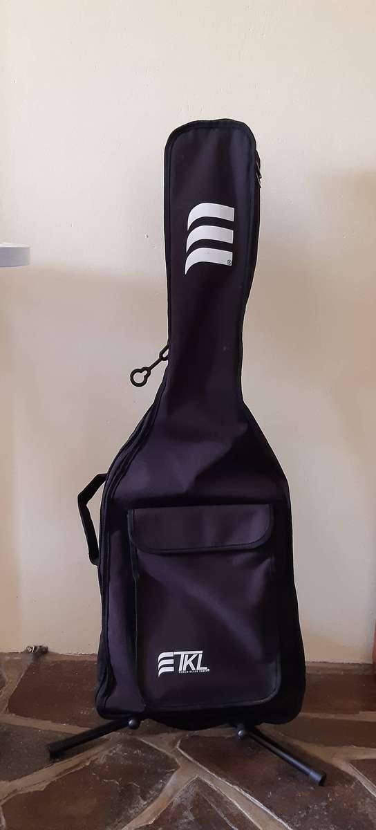 Kimaxe Electric Guitar with Stand, Guitar Bag and extra set of guitar strings for sale.