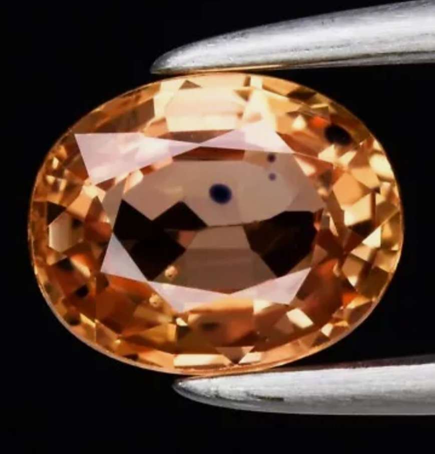 0.71ct Oval Cut Natural Orange Sapphire