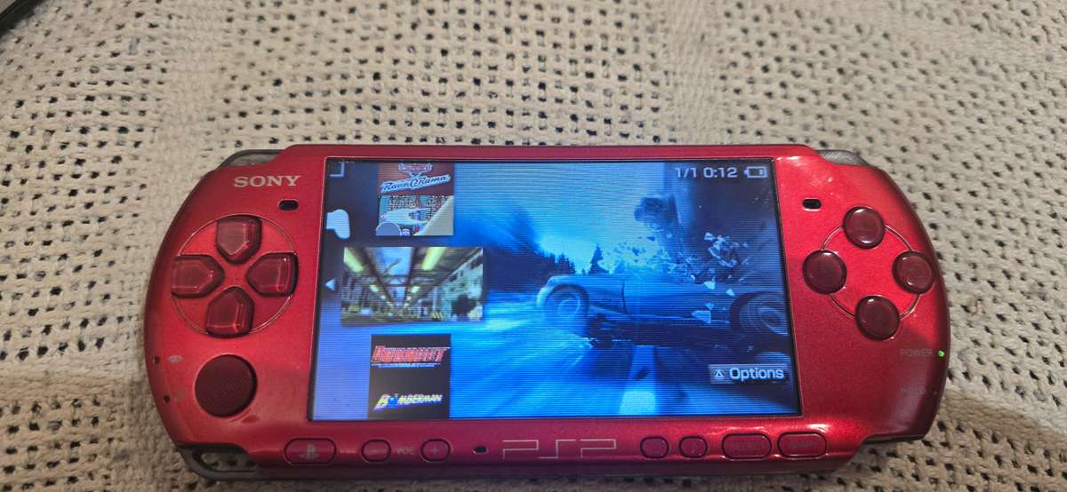 Red Psps 3000 modded 64gb loaded with 65+ games