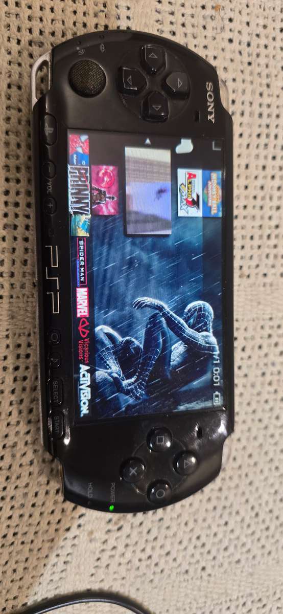 listing 1 PSP 3000 modded 64gb 60+games loaded