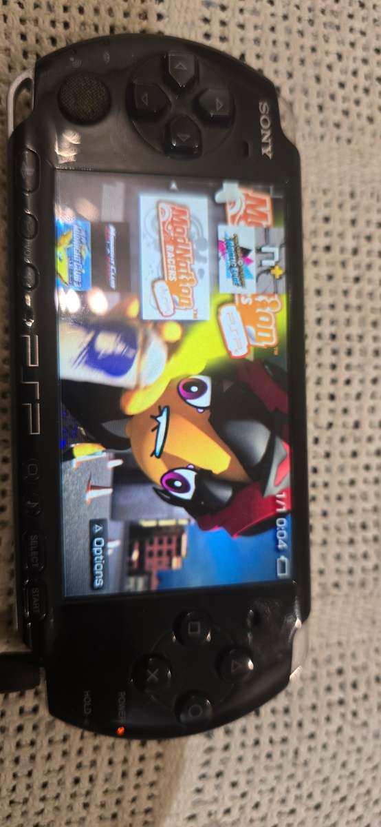 listing 1 PSP 3000 modded 64gb 60+games loaded