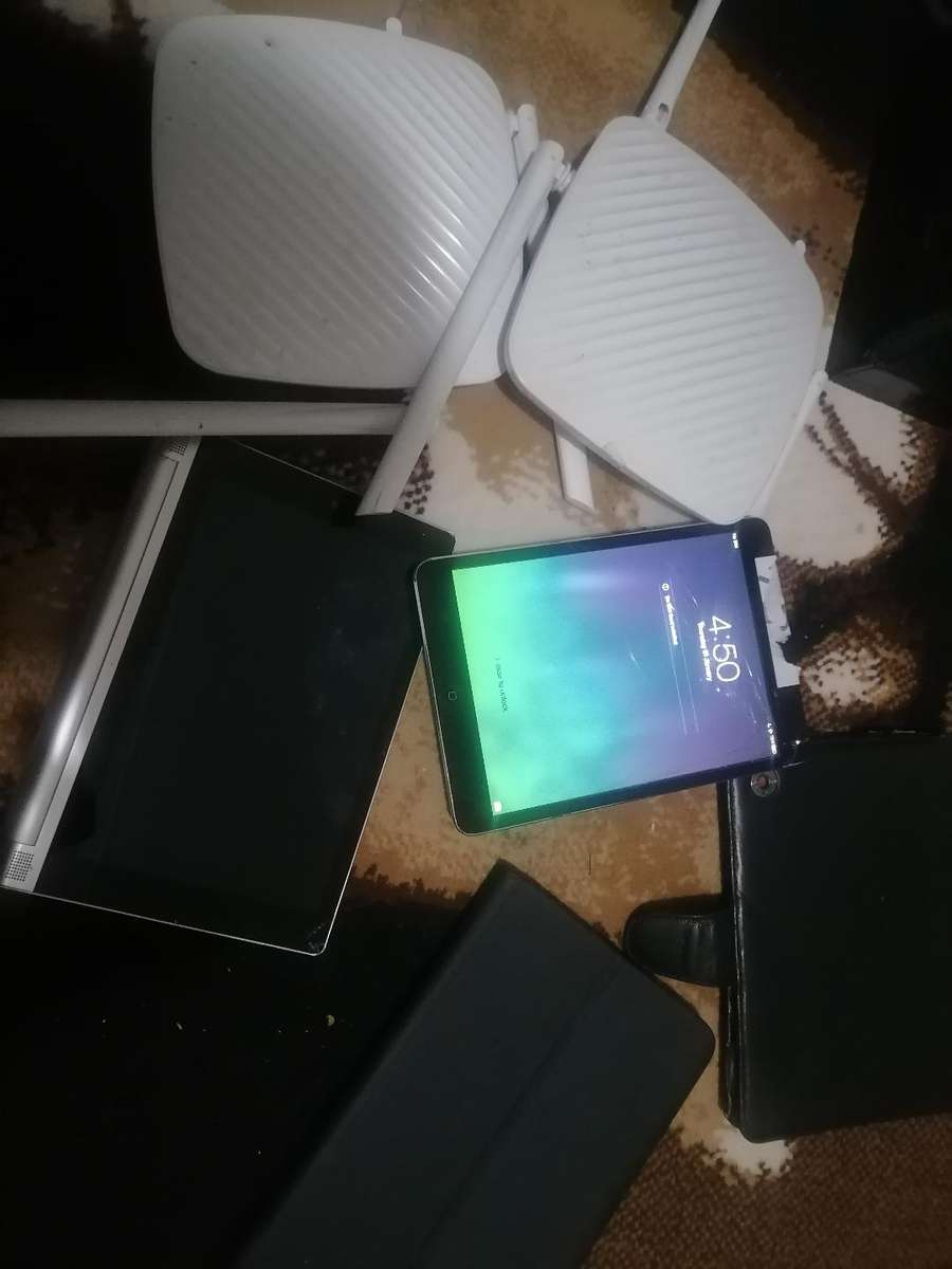 LOT OF WIFI ROUTERS,APPLE IPAD,LENOVO YOGA TABLET,POUCHES ETC*sold as is*one bid for lot*