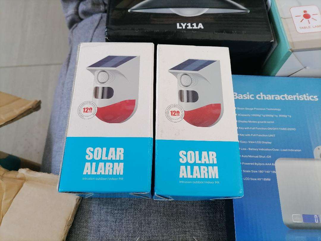 **LOT OF NEW ELECTRONICS*SOLAR MOTION ALARMS,CAMING LAMP,USB FAN,DIGITAL SCALE,TEMP/CLOCK*
