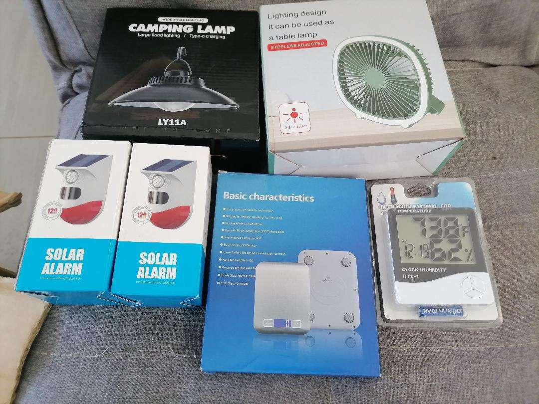 **LOT OF NEW ELECTRONICS*SOLAR MOTION ALARMS,CAMING LAMP,USB FAN,DIGITAL SCALE,TEMP/CLOCK*
