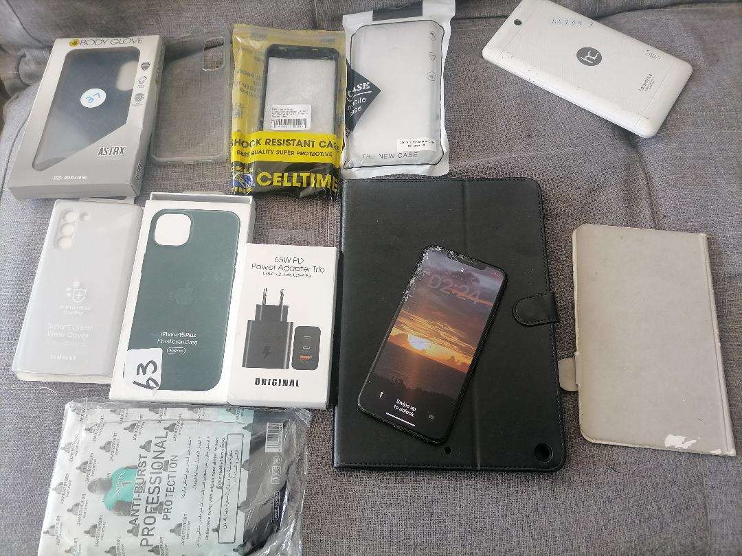 LOT OF APPLE PHONE, TABLET,NEW PHONE COVERS , ETC, ONE BID FOR THE LOT*