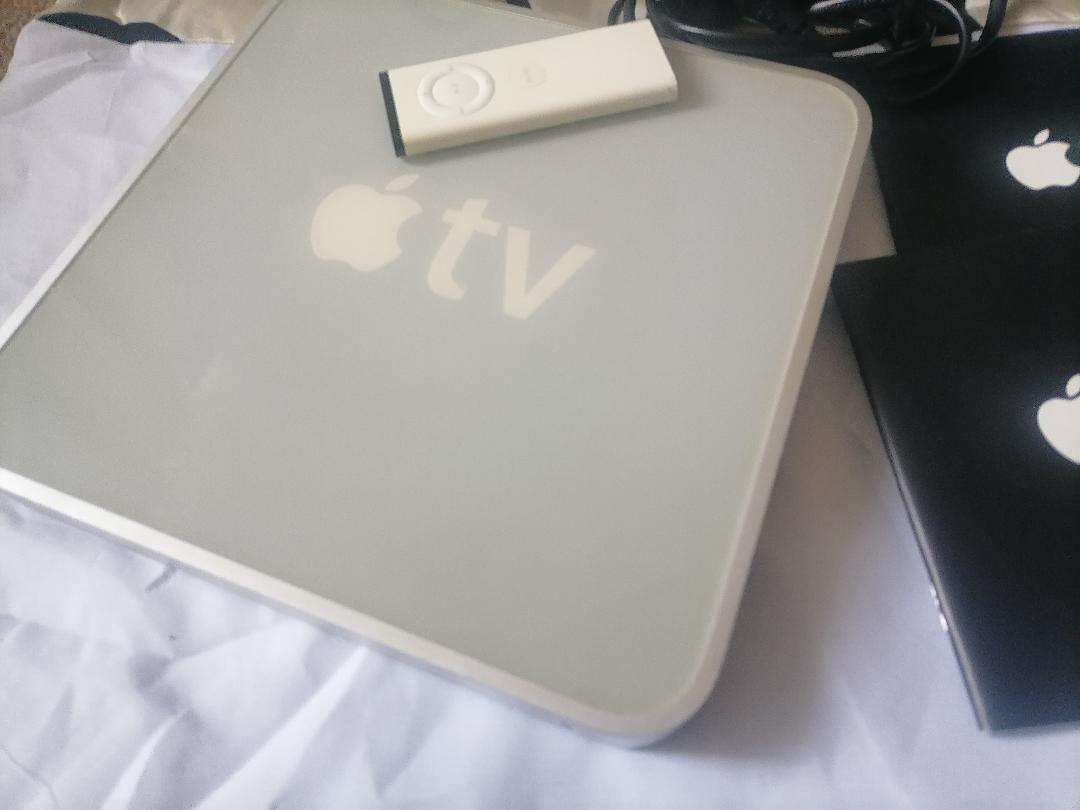 Apple A1218 TV Streaming Box with Remote and Cables in Box