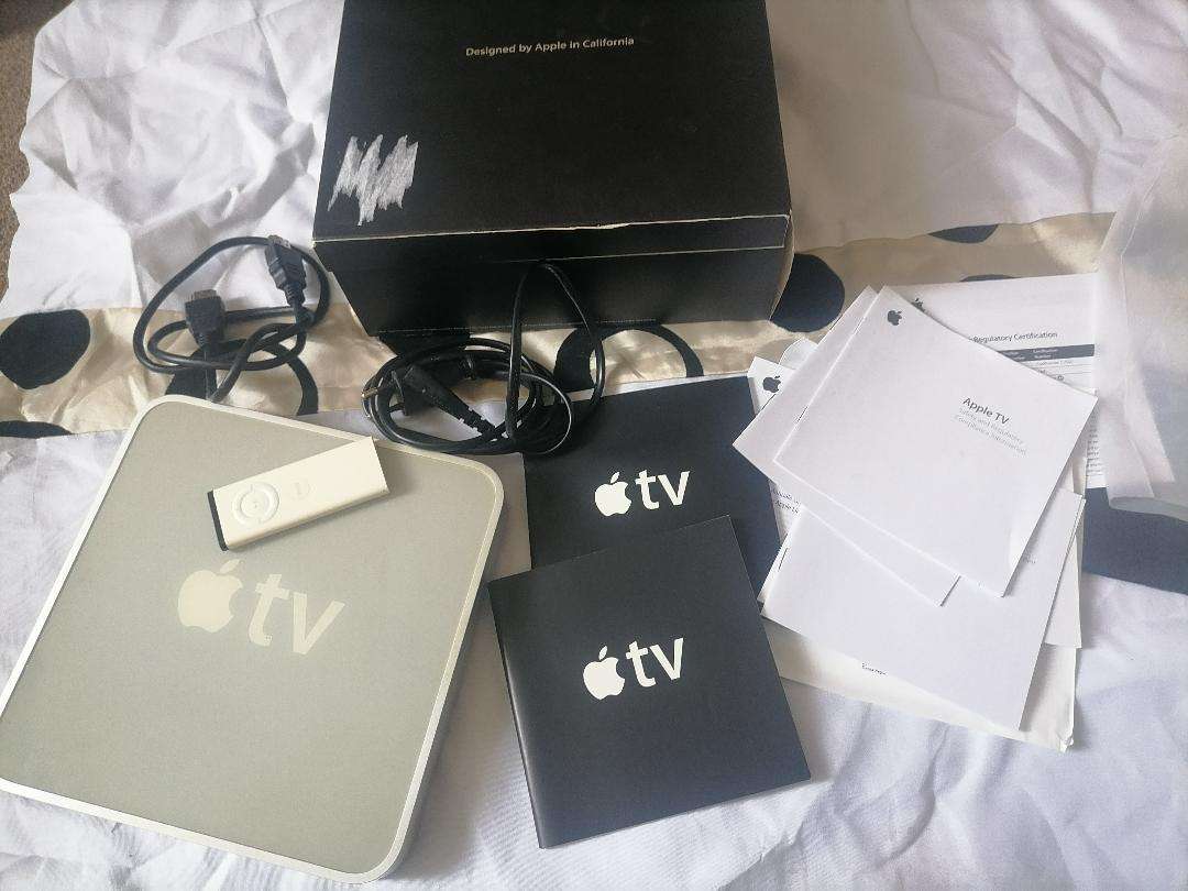 Apple A1218 TV Streaming Box with Remote and Cables in Box