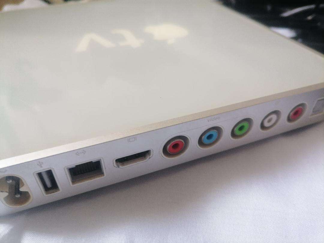 Apple A1218 TV Streaming Box with Remote and Cables in Box