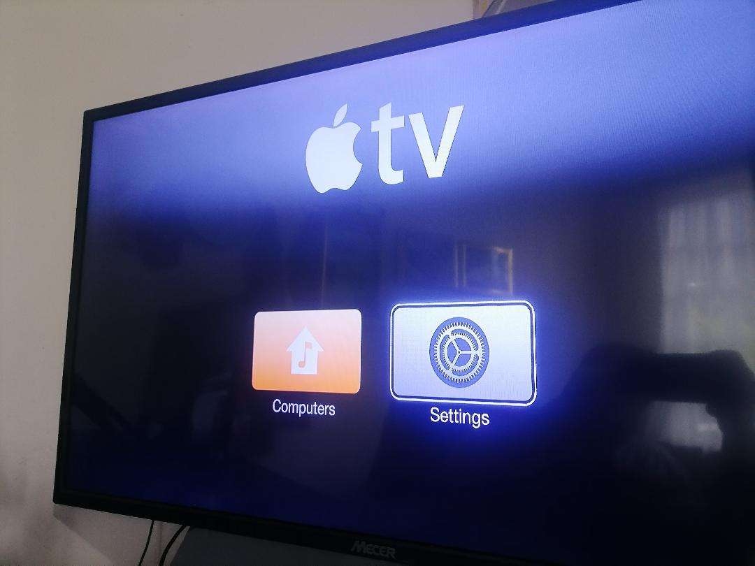 Apple A1469 TV Streaming Box with Remote and Cables