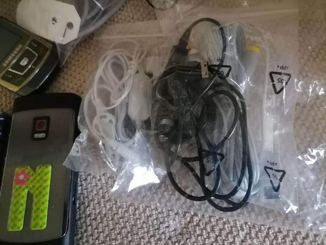 LOT OF UNTESTED CELLPHONES,CABLES,HEADSETS ETC*ONE BID FOR THE LOT