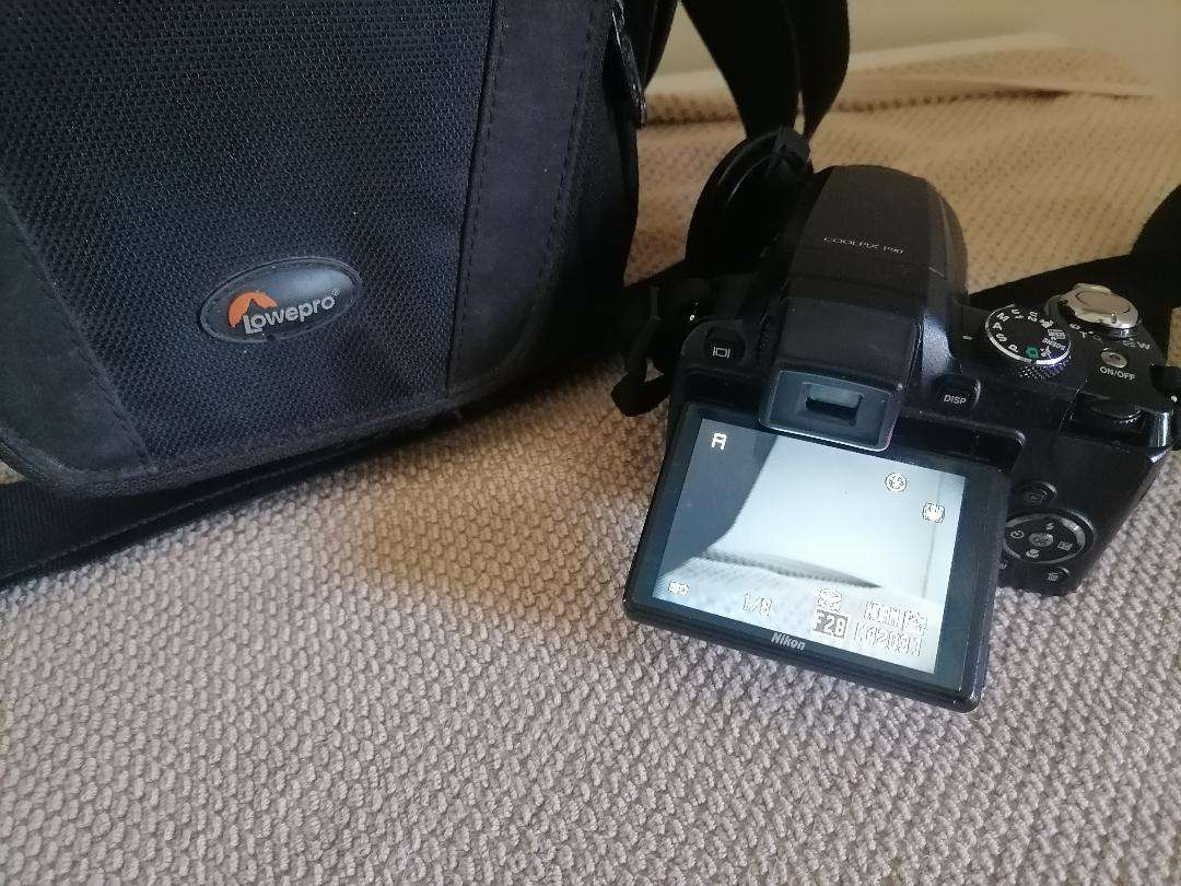 Nikon Coolpix P90 Camera with Tilt LCD Screen, Charger, 2 Batteries, in Bag