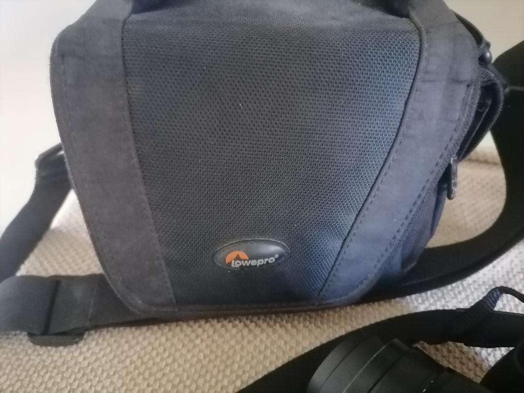 Nikon Coolpix P90 Camera with Tilt LCD Screen, Charger, 2 Batteries, in Bag