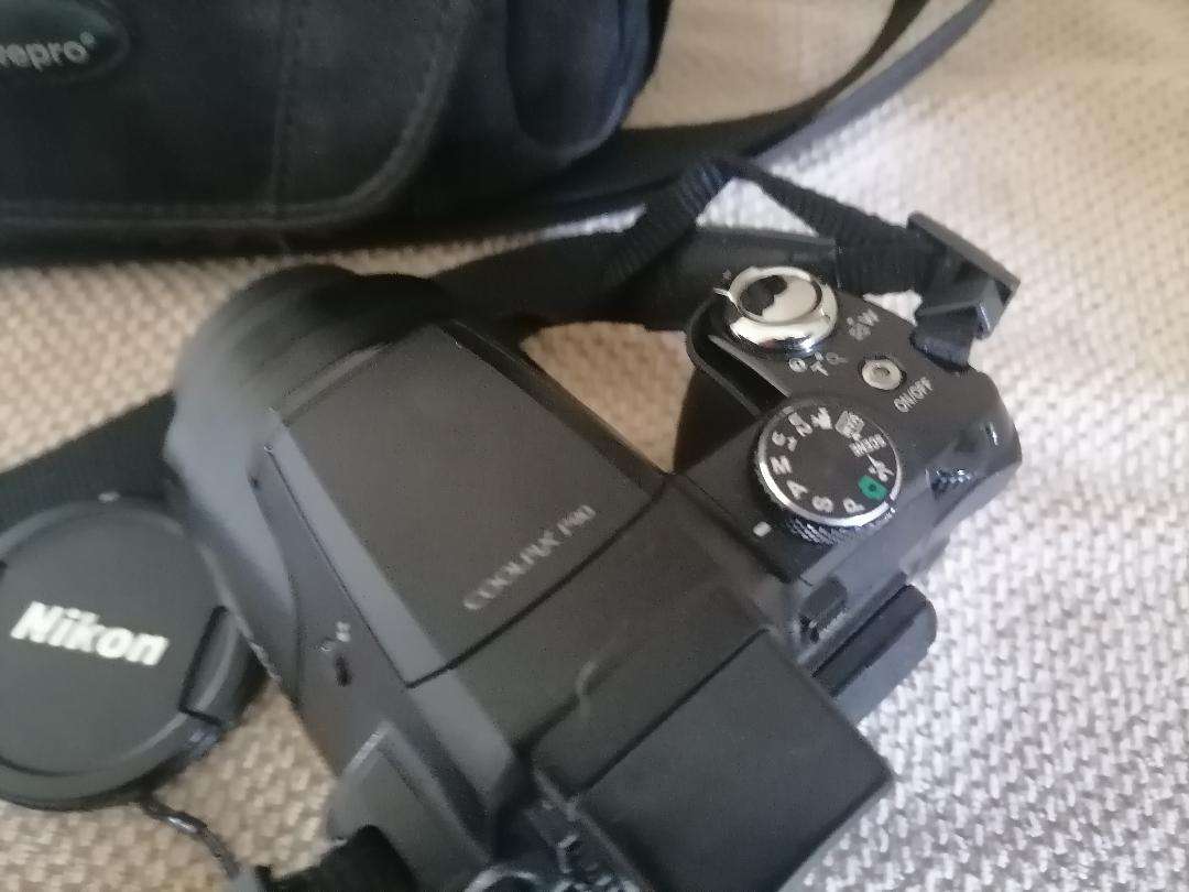 Nikon Coolpix P90 Camera with Tilt LCD Screen, Charger, 2 Batteries, in Bag
