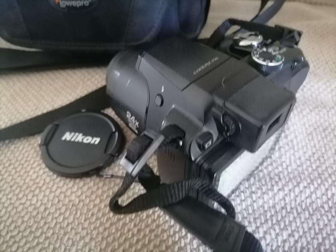 Nikon Coolpix P90 Camera with Tilt LCD Screen, Charger, 2 Batteries, in Bag