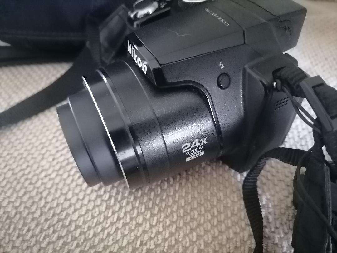 Nikon Coolpix P90 Camera with Tilt LCD Screen, Charger, 2 Batteries, in Bag