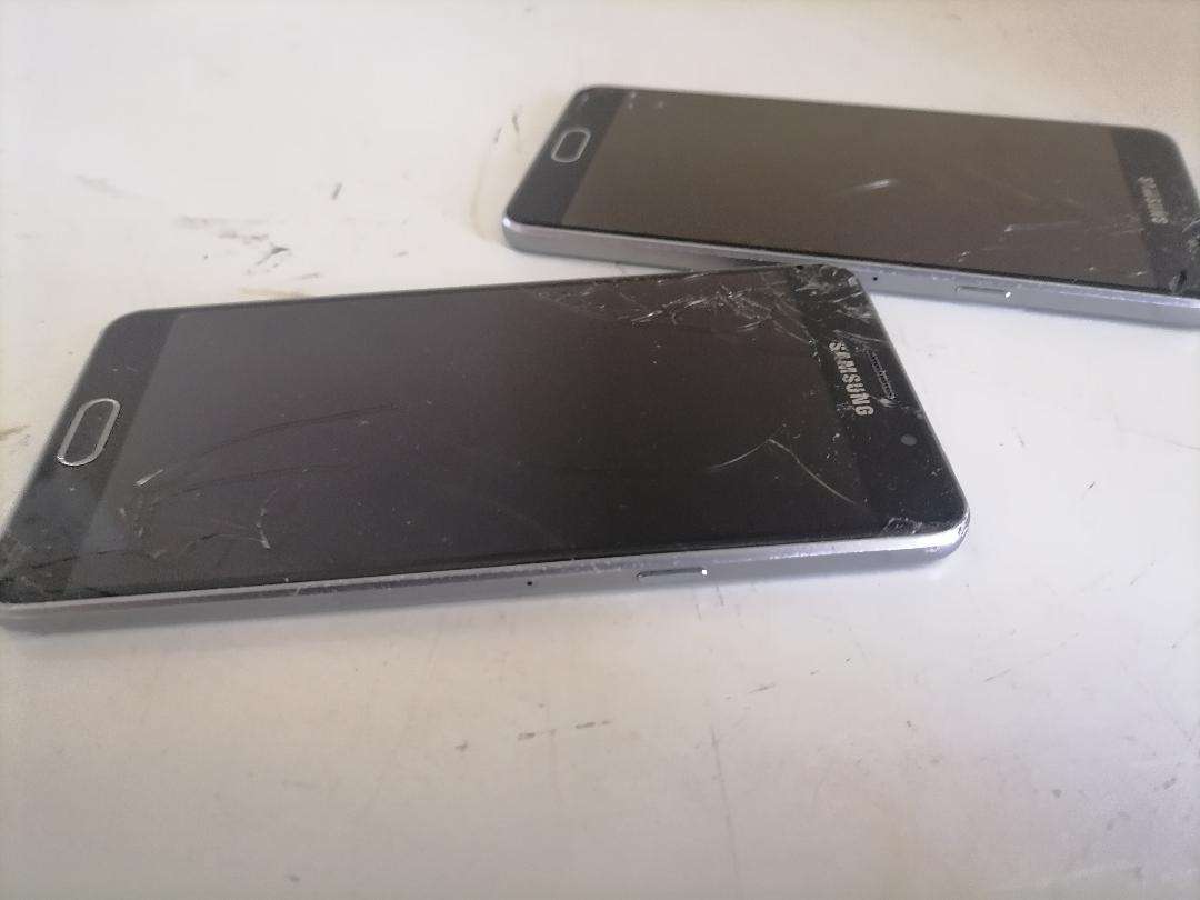 Lot of 2 x Defective Samsung A5 Cell Phones - One Bid for Both