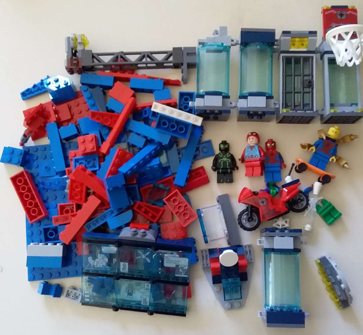 4 Lego Spiderman Minifigures with Accessories, Spider Lair Parts and extra bricks