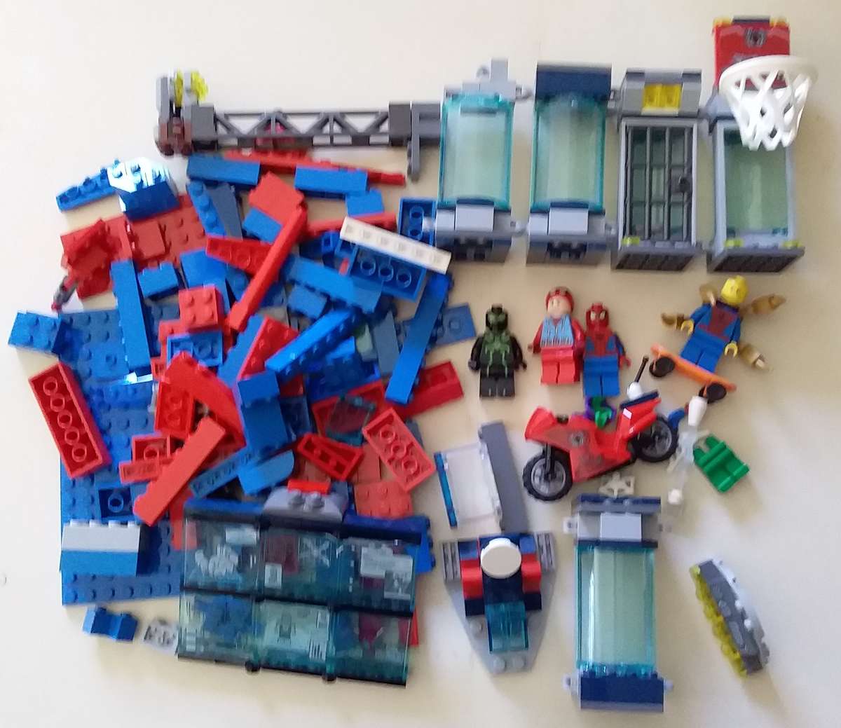 4 Lego Spiderman Minifigures with Accessories, Spider Lair Parts and extra bricks