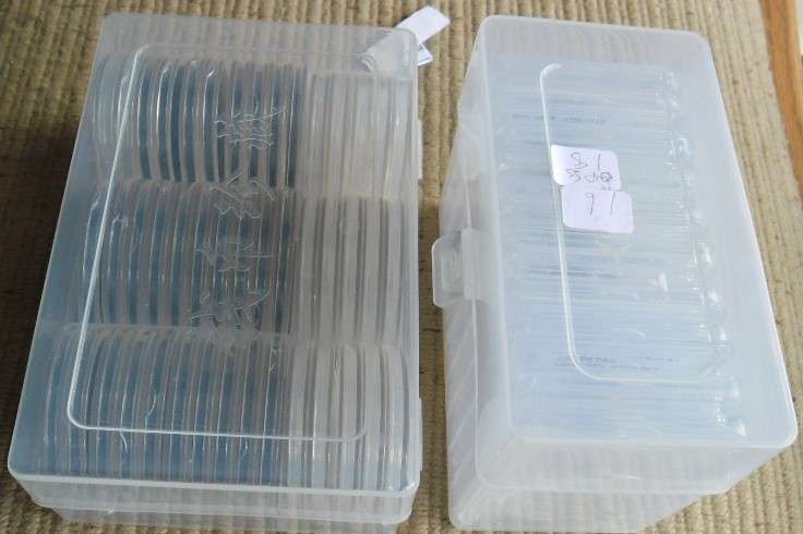 PLASTIC HOLDER WITH 45 COIN HOLDERS PLUAS BOX WITH 10 CLEAR SLABS USED CONDITION