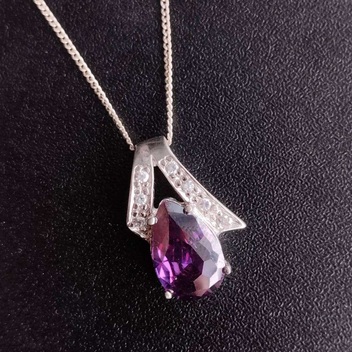 Sterling Silver Necklace featuring a pear-cut amethyst and cubic zirconia accents