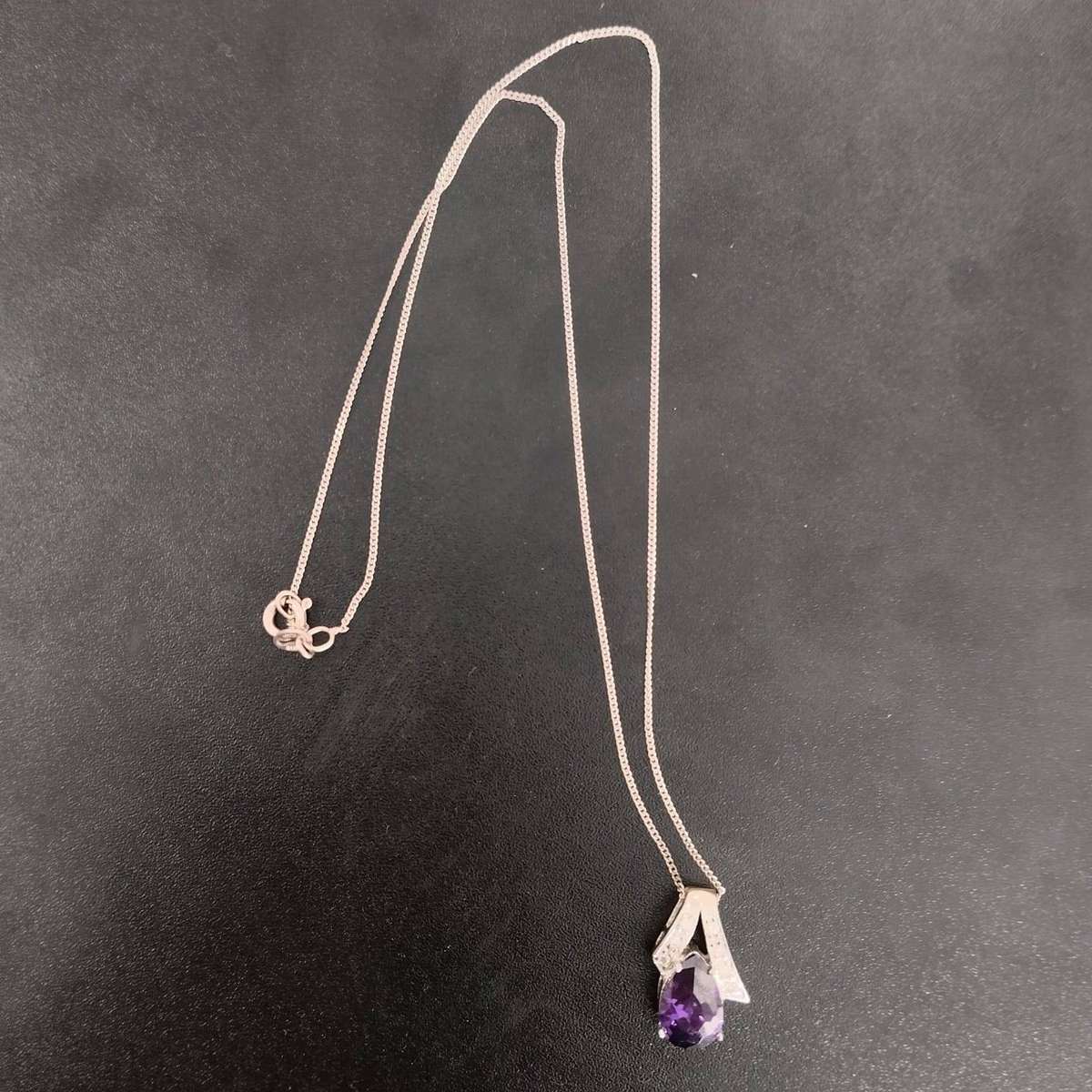 Sterling Silver Necklace featuring a pear-cut amethyst and cubic zirconia accents