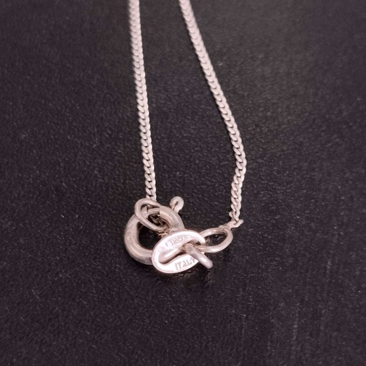 Sterling Silver Necklace featuring a pear-cut amethyst and cubic zirconia accents