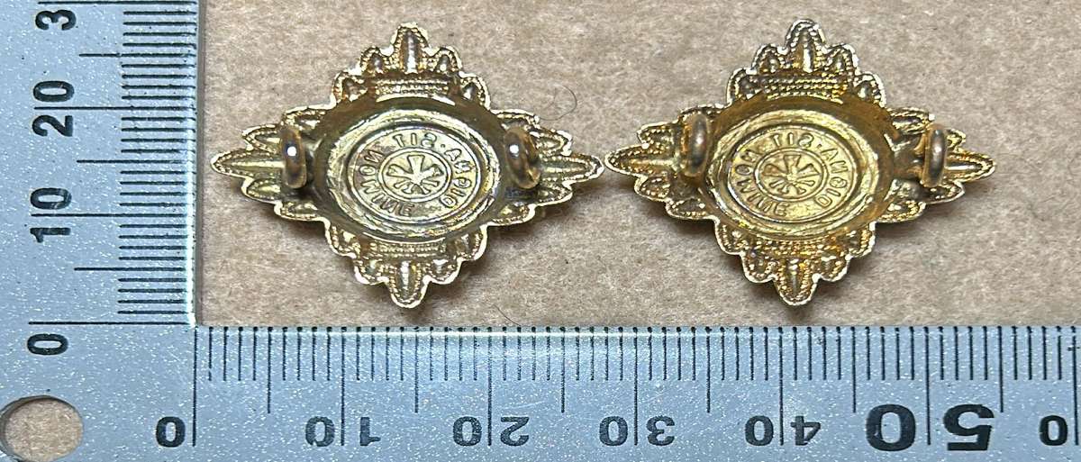 RHODESIA CROWNS AND PIPS - 2 BRASS PIPS WITH RED ENAMEL