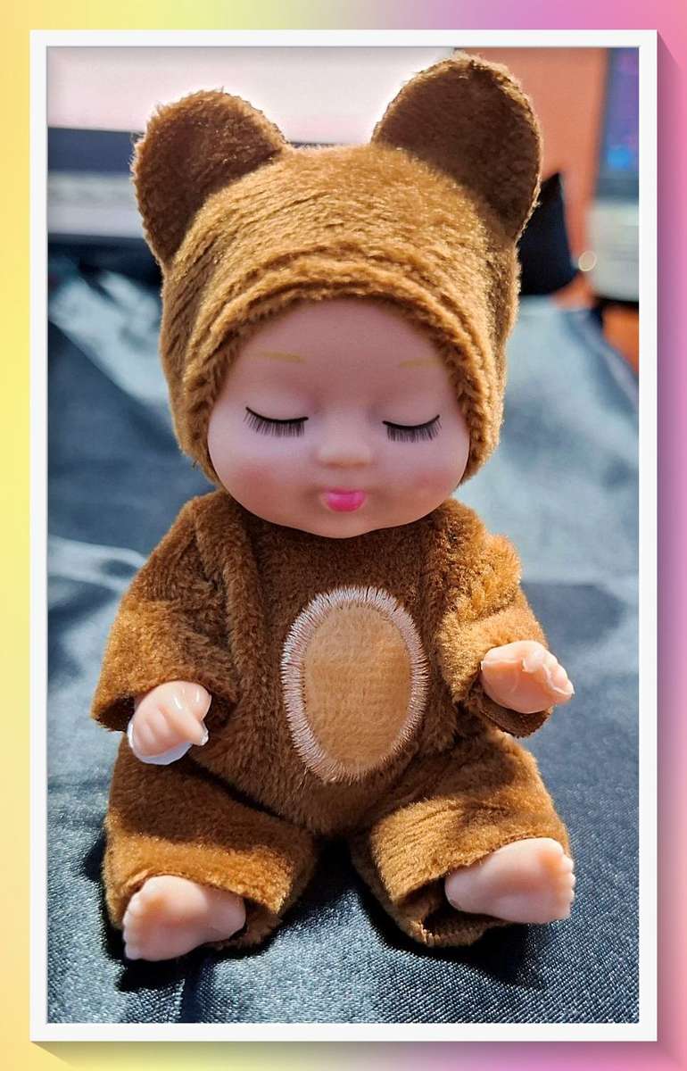 Adorable sleeping teddy bear baby doll