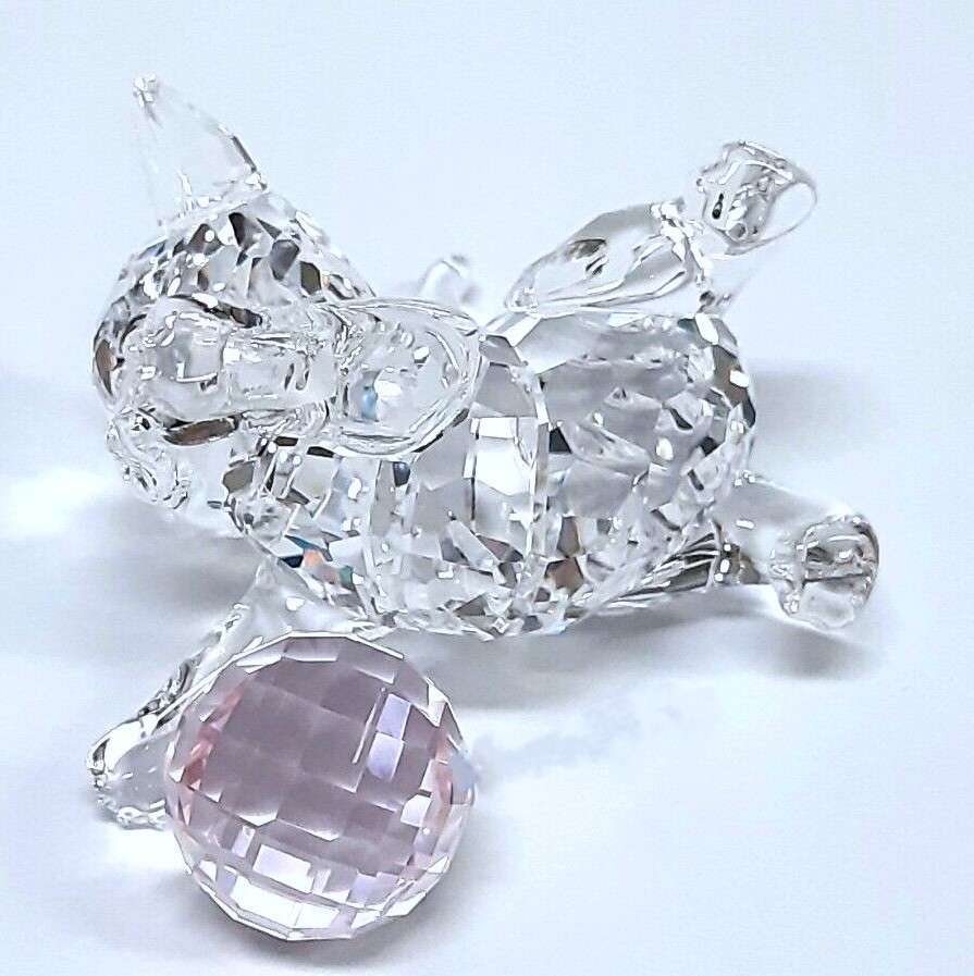 Swarovski Crystal Kitten is playing with a pink ball of wool