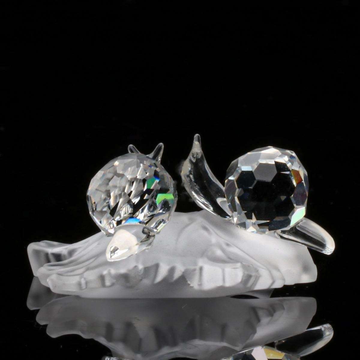 Swarovski Crystal Baby Snails on a Vine Leaf Among Flowers and Foliage