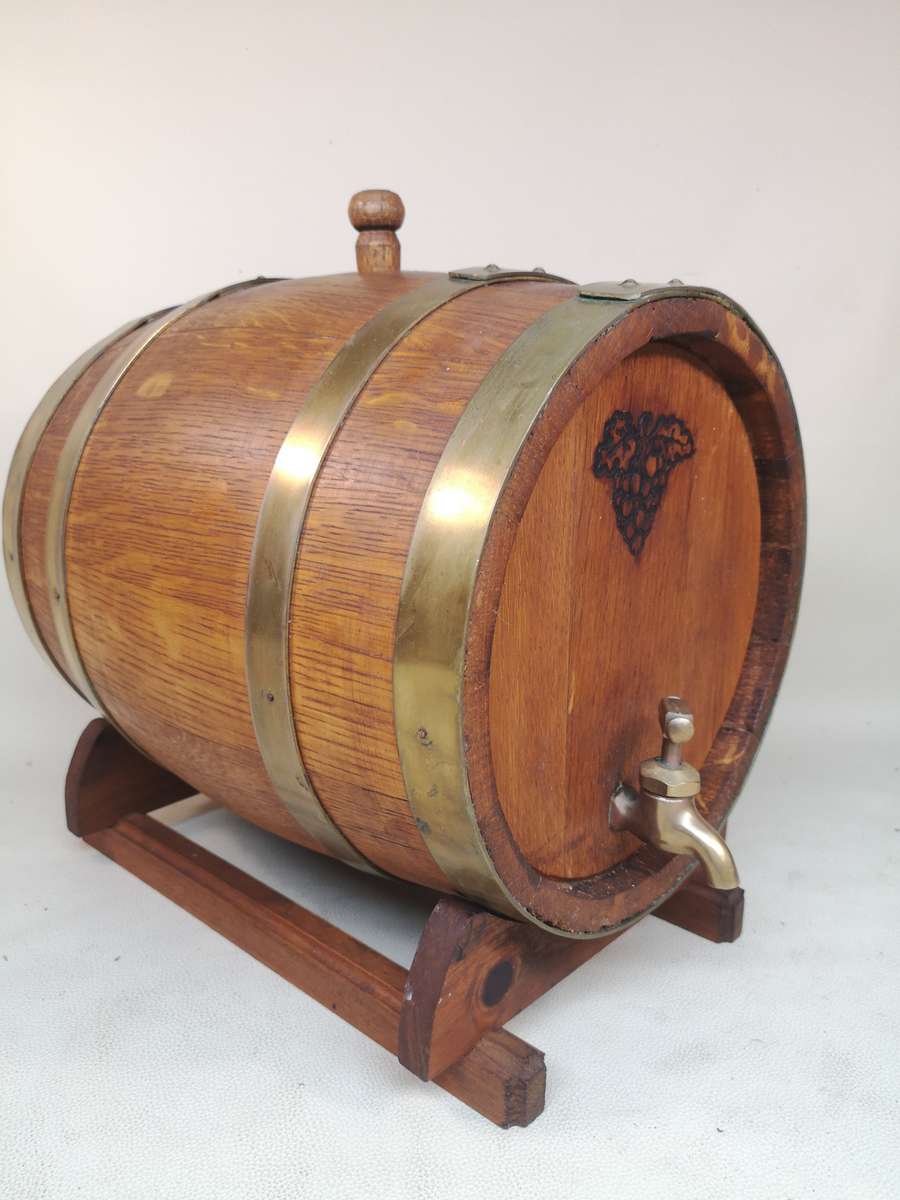 A Stunning Vintage Large solid Oak 10 Liter wine barrel with brass hoops, tap & stand