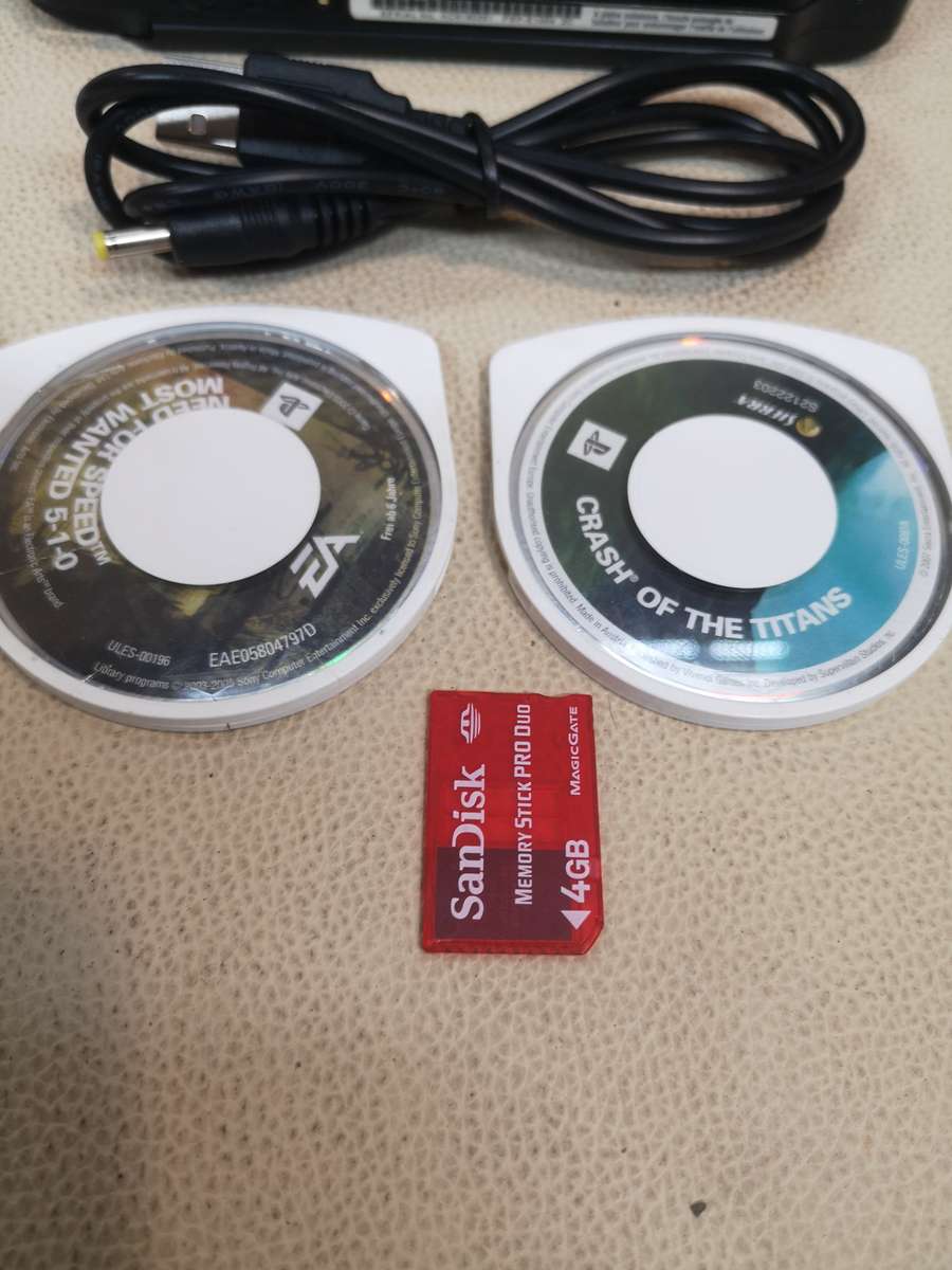 Sony psp sreet (Psp - E1004) charcoal black console with original packaging and games bundle