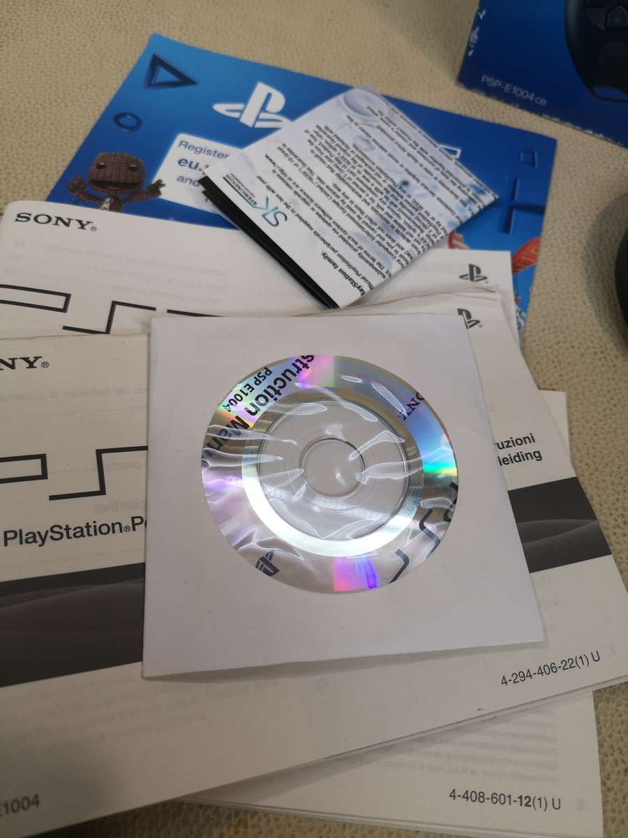 Sony psp sreet (Psp - E1004) charcoal black console with original packaging and games bundle