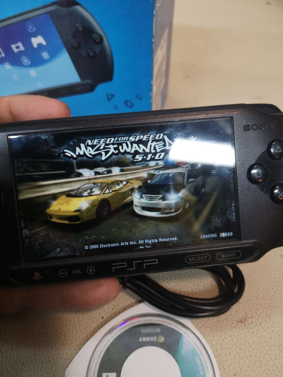 Sony psp sreet (Psp - E1004) charcoal black console with original packaging and games bundle