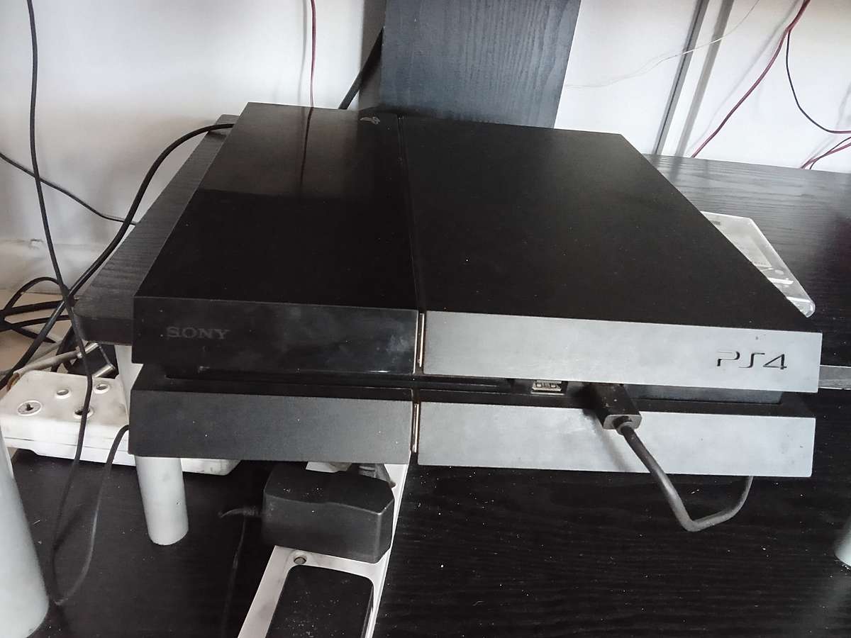 Faulty ps4 with 15 games and 2 controllers for sale.