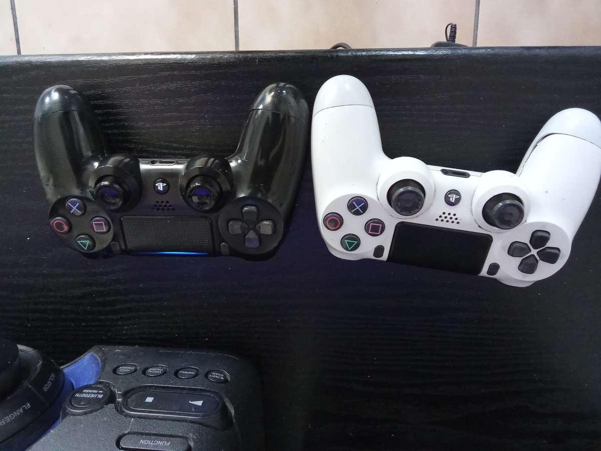 Faulty ps4 with 15 games and 2 controllers for sale.
