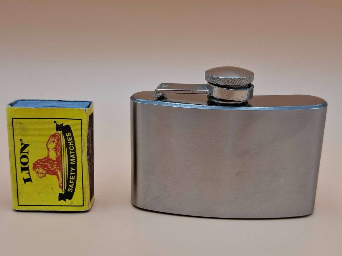Vintage Stainless Steel Hip Flask - Curved Design with Screw-on Cap connected to Flask