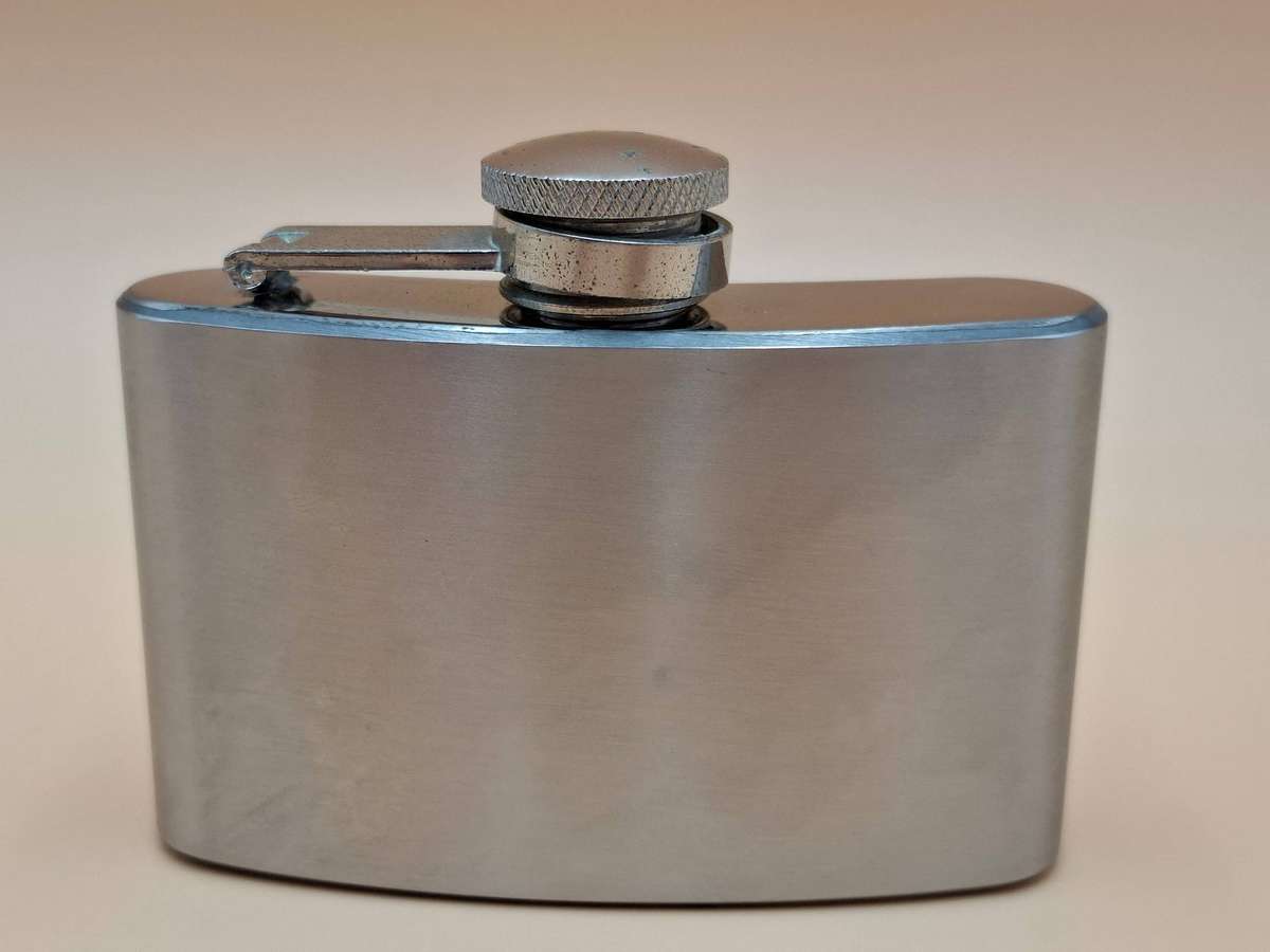 Vintage Stainless Steel Hip Flask - Curved Design with Screw-on Cap connected to Flask
