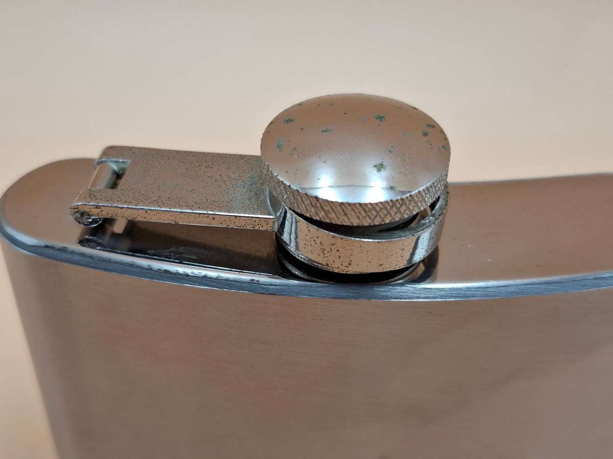 Vintage Stainless Steel Hip Flask - Curved Design with Screw-on Cap connected to Flask