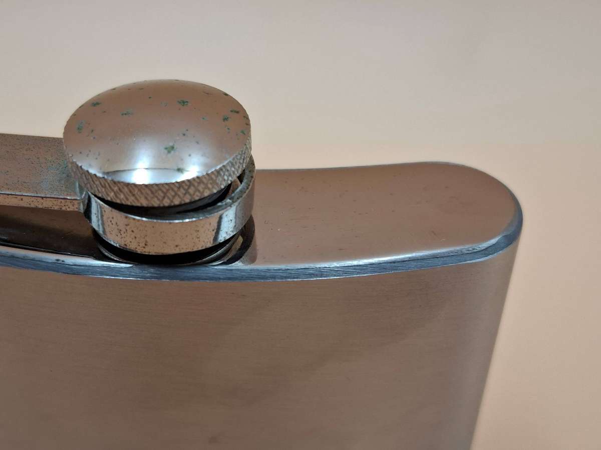 Vintage Stainless Steel Hip Flask - Curved Design with Screw-on Cap connected to Flask